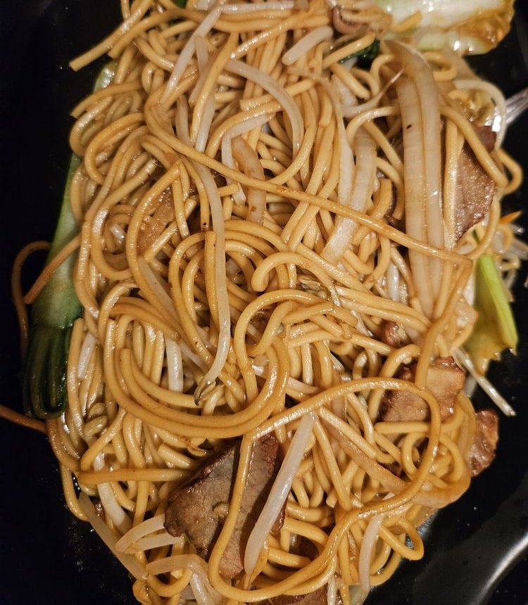 Pan-fried noodles with bean sprouts, pork and bok choy